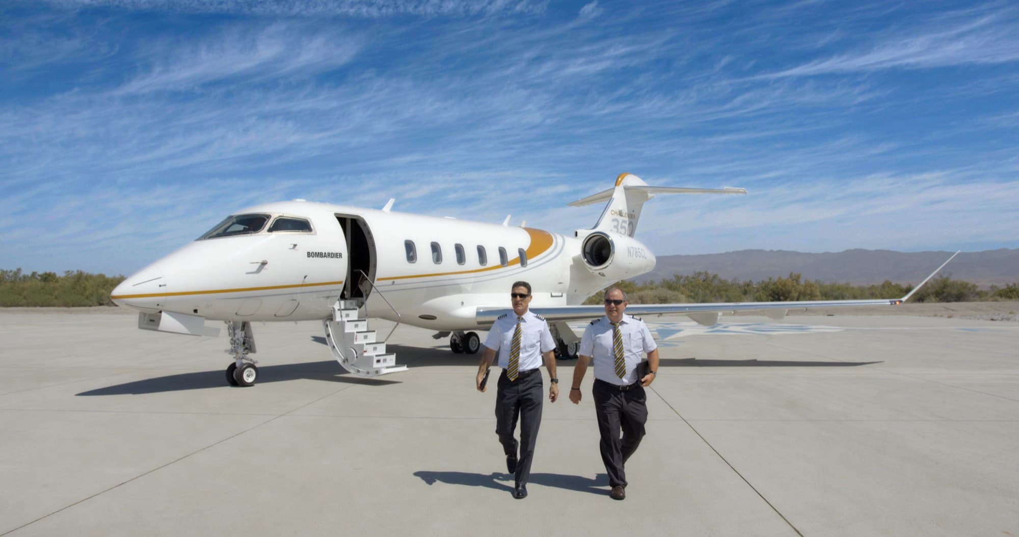 Bombardier Challenger 350 in flight above the clouds