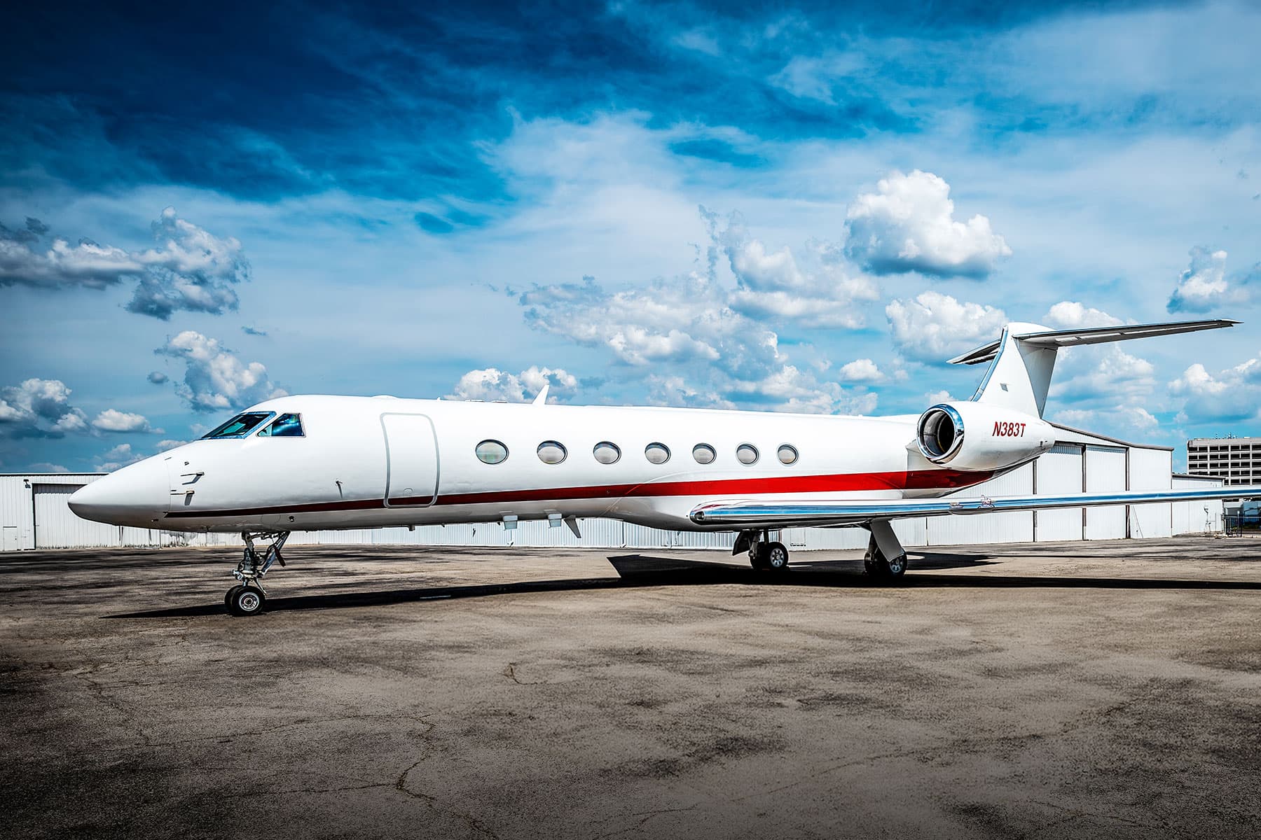 Gulfstream G550 on the ramp under a dramatic blue sky